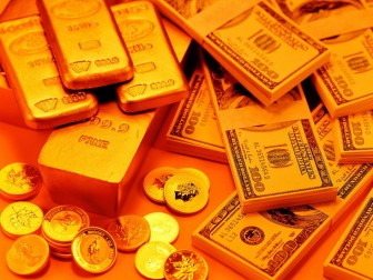 Gold inches up after posting 1-pct weekly loss