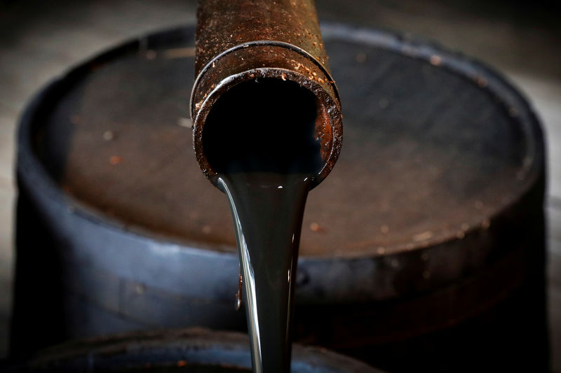 Iran sanctions seen keeping oil above , but 2019 demand outlook darkens