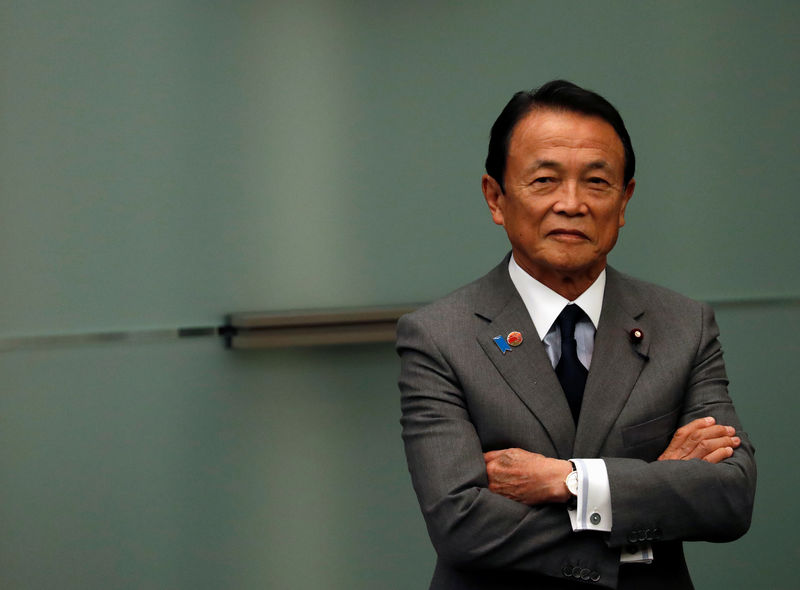 Japan's Aso defends government stance on wages amid concerns on data