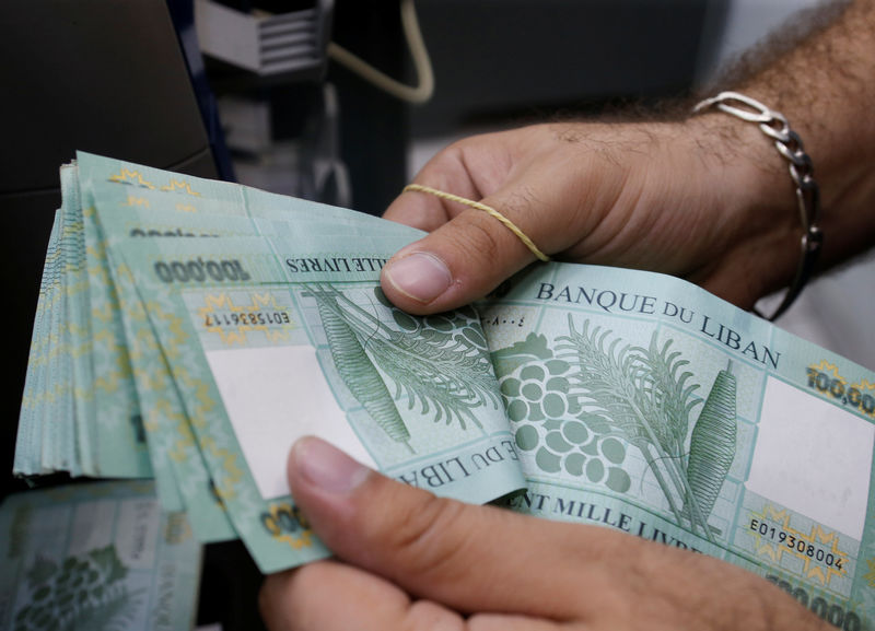 Lebanon banks suck in dollars to maintain peg, but economy stagnates