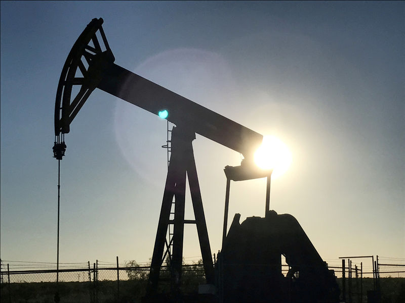 Oil slides towards weekly loss on excess supply worries