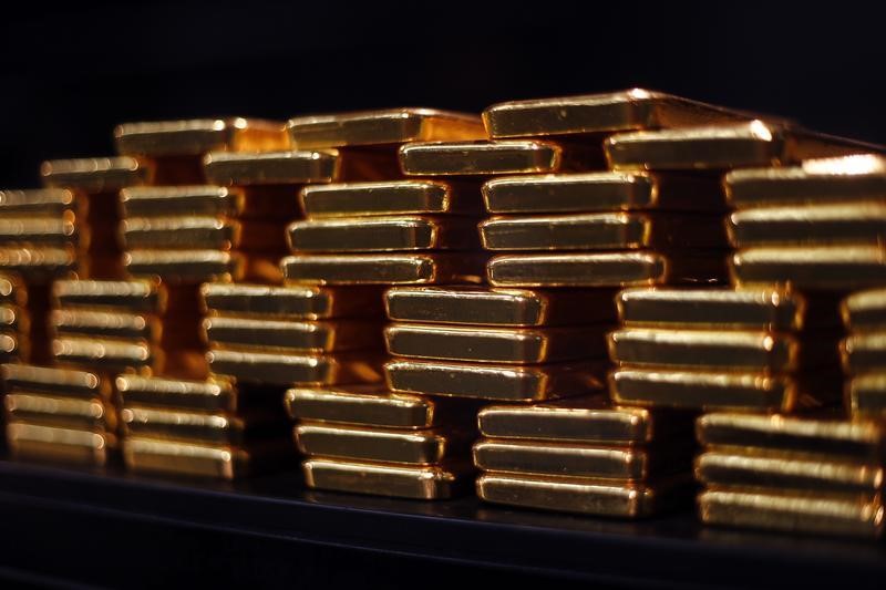 Gold hovers around ,930, set for muted week ahead of PCE inflation