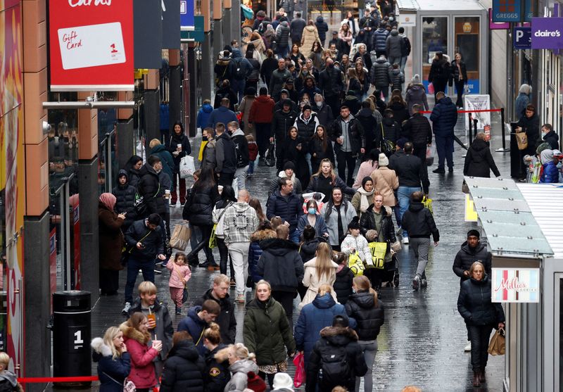 UK shoppers slash December spending after earlier Xmas spree, Omicron
