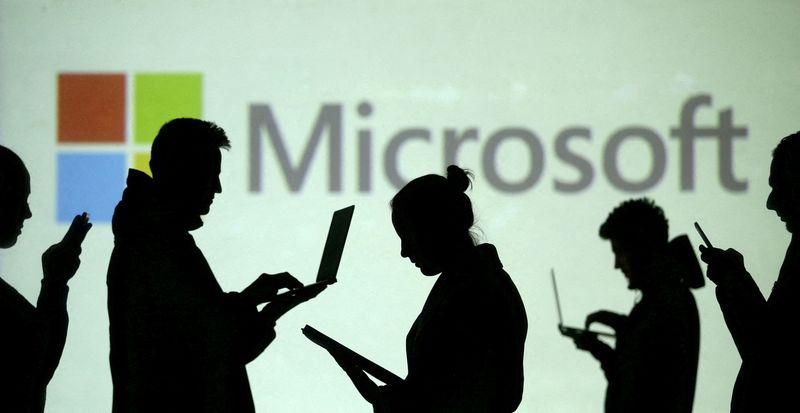 Microsoft warns of forex hit, cuts forecast