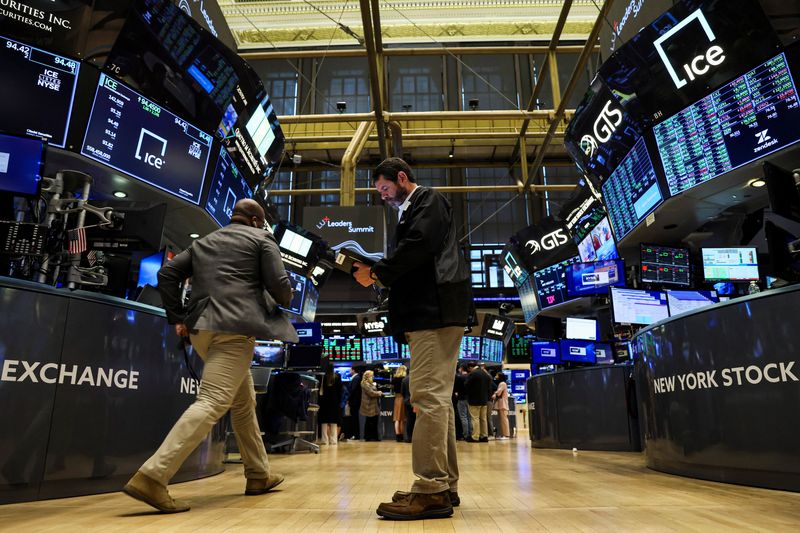 Wall St slides as Fed signals more interest rate hikes