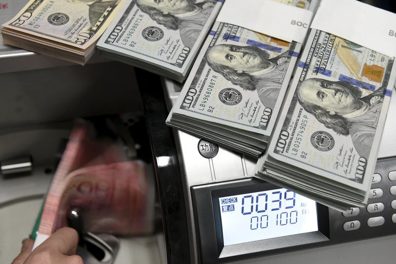 Dollar creeps up in subdued start to new year