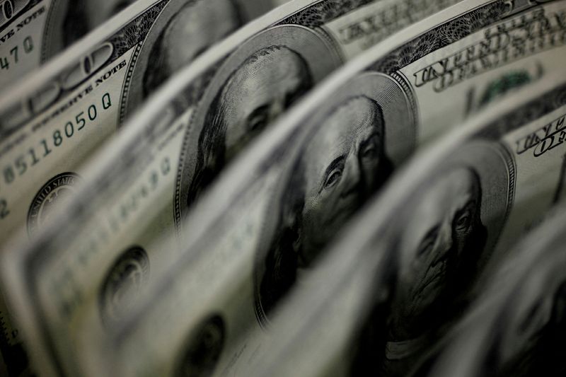 Dollar steady after Fed's rate pause hints, yen rises